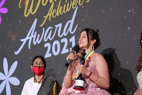 Harshika Poonacha with her Women's Achiever Award 