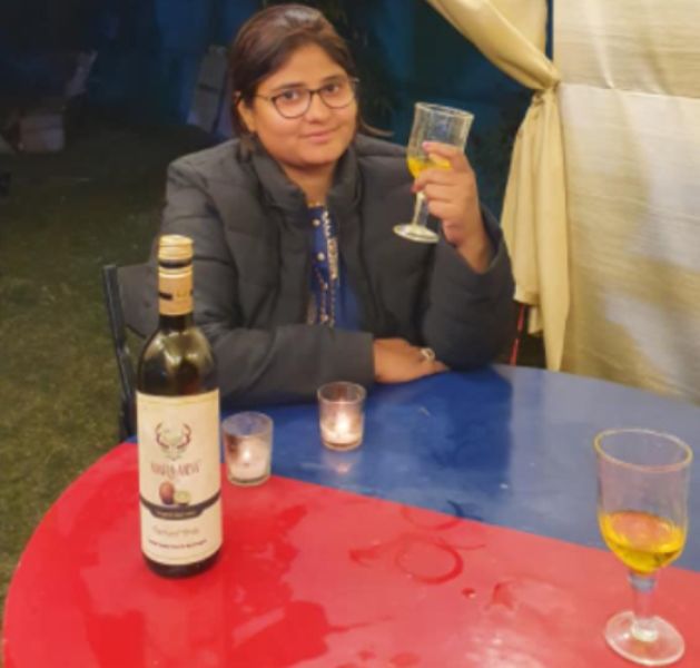 Neha Shree with a glass of wine