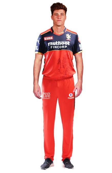 Finn Allen posing for a picture in the RCB's kit