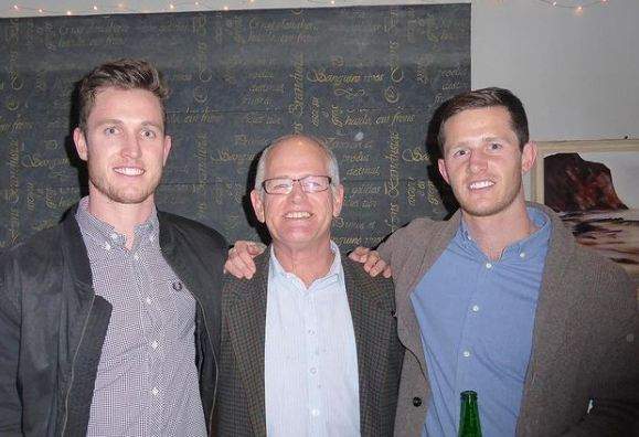 Adam Milne with his father and brother