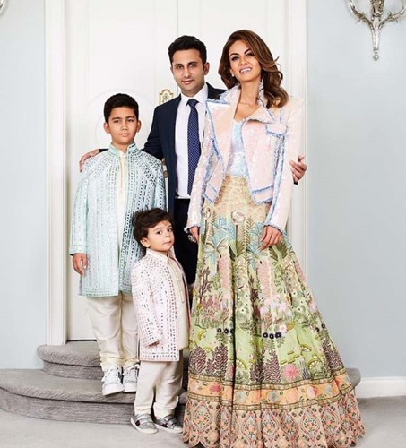 Adar Poonawalla with his wife, Natasha, and his sons, Cyrus (left) and Darius (front)