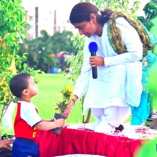 Bharti Shri Ji with a kid
