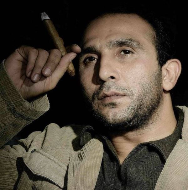 Bikramjeet Kanwarpal holding a cigar