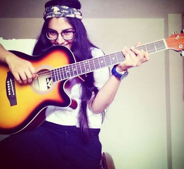 Chetna Sharma playing guitar