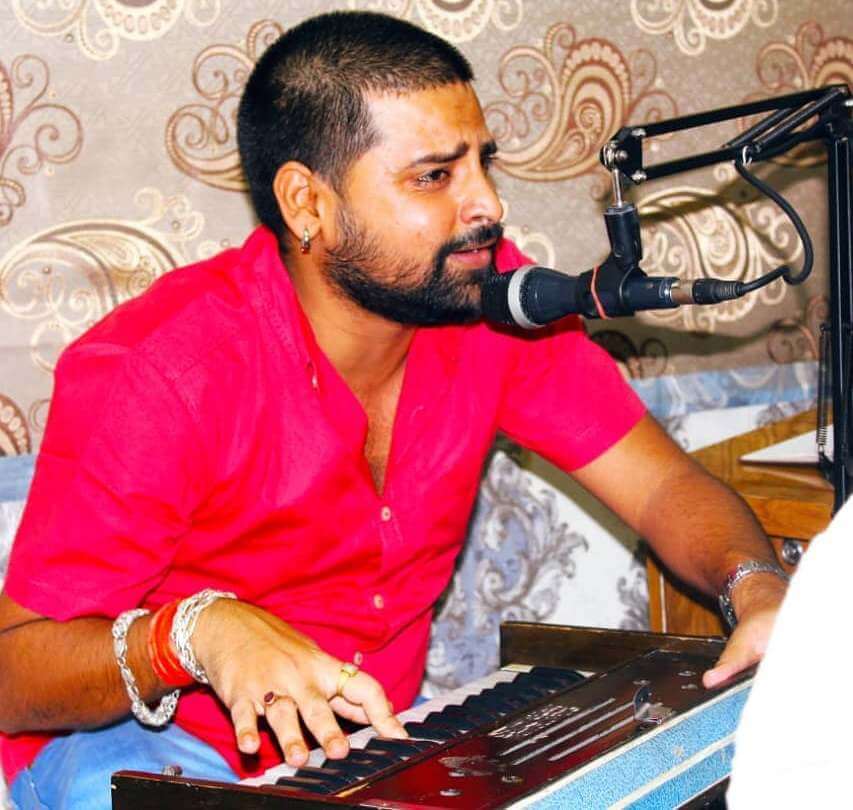 Rakesh Mishra playing the harmonium