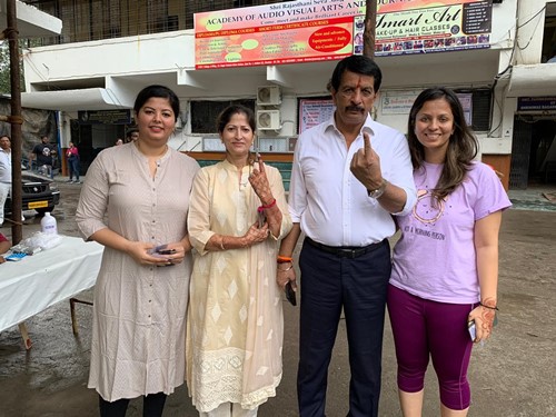 Pradeep Sharma with his wife and daughters
