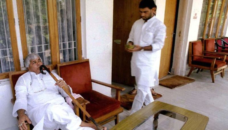 Rabri Devi's husband, Lalu Yadav (sitting), while her brother Sadhu Yadav is approching to him