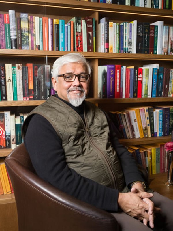 Amitav Ghosh while sitting in his library