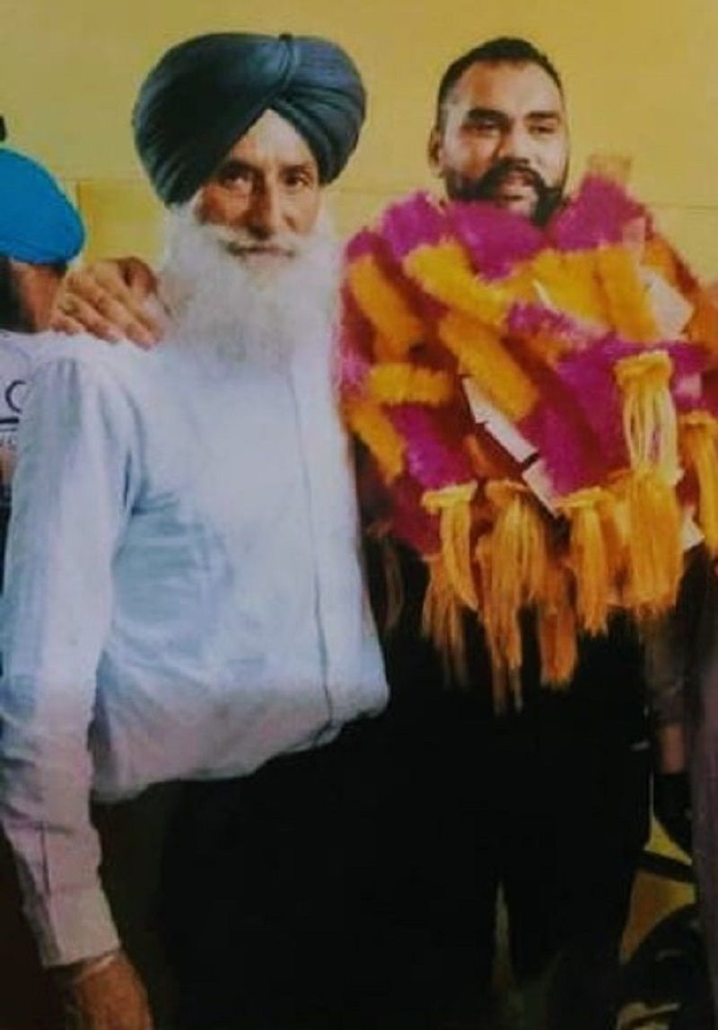 An old picture of Tajinderpal Singh Toor with his coach