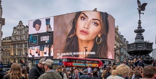 Diipa Khosla's picture on a billboard in Piccadilly Circus