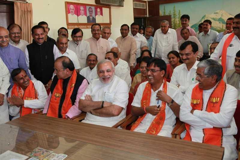 Mansukh Mandaviya with Narendra Modi and other politicians after becoming a Rajya Sabha member