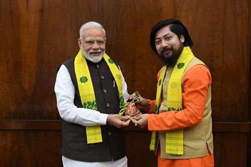Nisith Pramanik with the Prime Minister of India Narendra Modi during the oath-taking ceremony