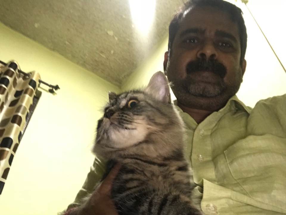 Ojha Sir with his pet cat 