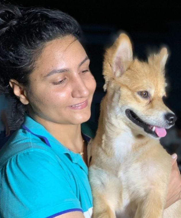 Pooja Rani with a dog