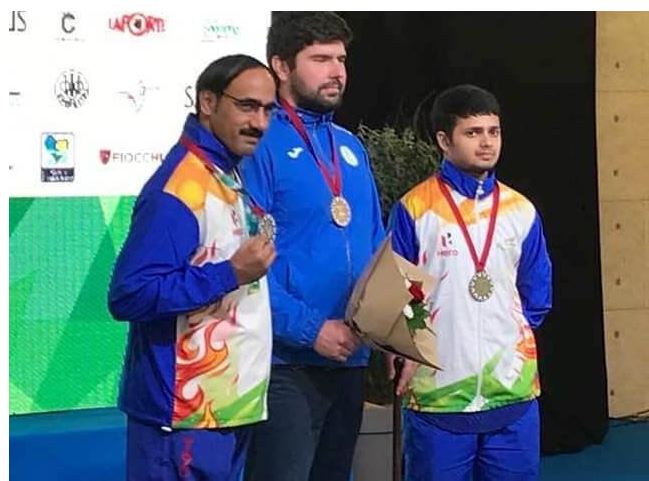 From the left: Singhraj Adhana, Oleksii Denysiuk, and Manish Narwal at the Para Shooting World Cup in Chateauroux