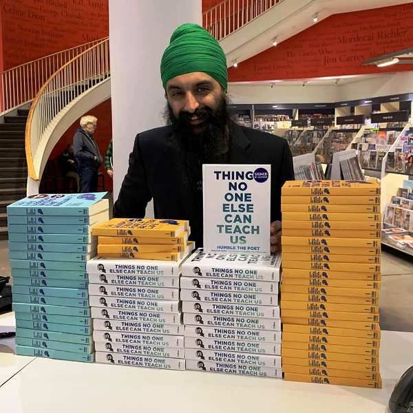 Humble The Poet with signed copies of his third book