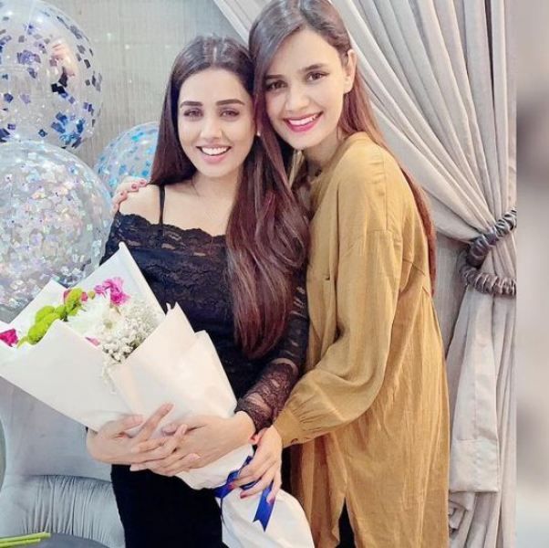 Kiran Haq with her sister