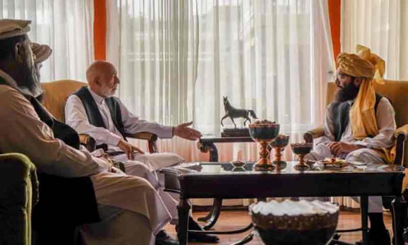 Mullah Abdul Ghani Baradar and Hamid Karzai during a meeting