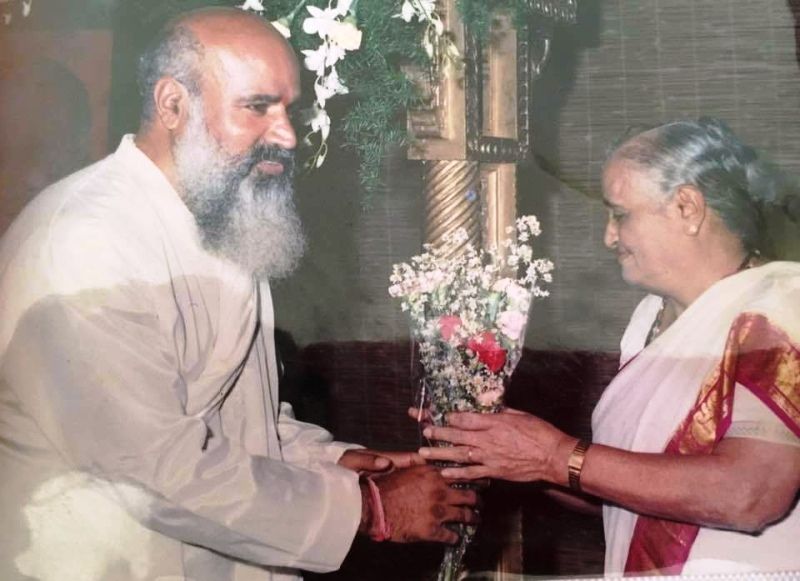 Rishi Prabhakar giving flowers to his mother Ramadevi Amma