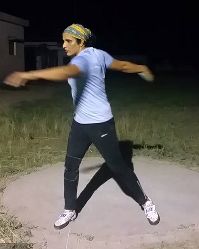 Seema Punia while practising discus throw