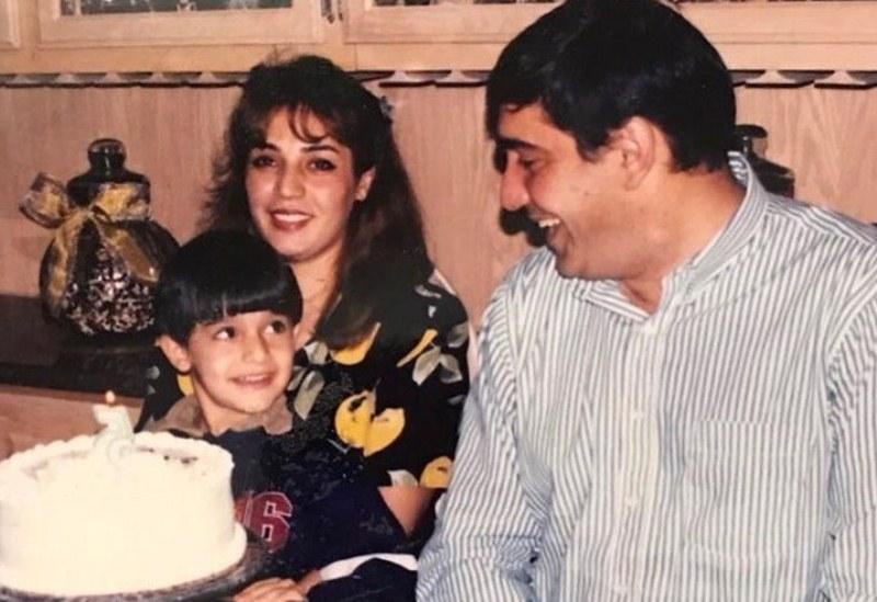 A childhood picture of Sam Asghari with his parents