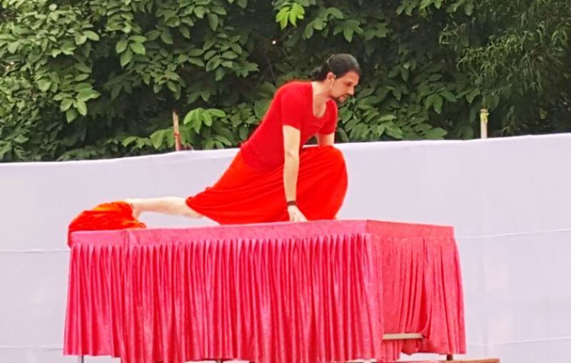 Anand Giri doing yoga at an event