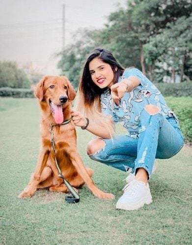 Ashima Chaudhary with her pet dog