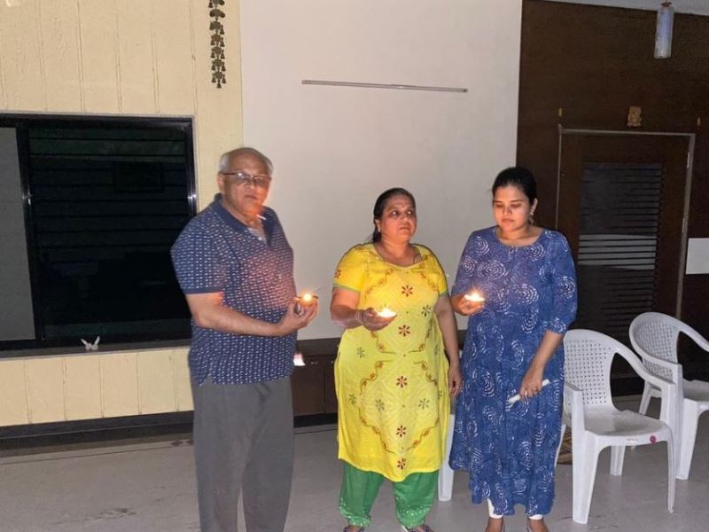 Bhupendra Patel with his wife and daughter