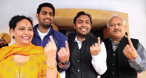 Brahm Mohindra (right) with his wife and sons after casting their vote