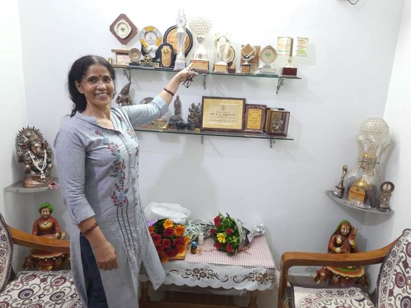 Jagrati Awasthi's mother showing Jagrati's school trophies