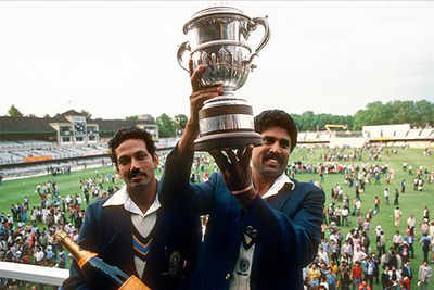 Kapil Dev with the World Cup trophy alongside Mohinder Amarnath