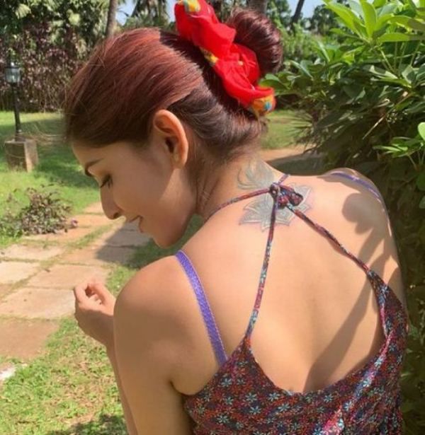 Mira Jagganath tatoo on neck