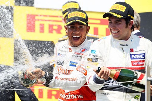 Sergio Perez celebrates his podium finish with Lewis Hamilton