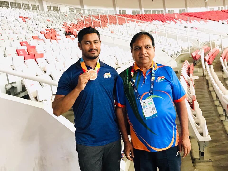 Sundar Singh with his coach