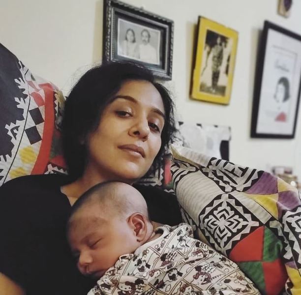 Yasra Rizvi holding her son
