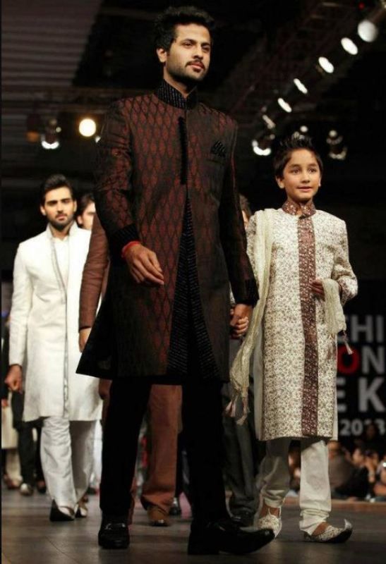 Zuhab Khan walking down the runway for a traditional wear fashion show