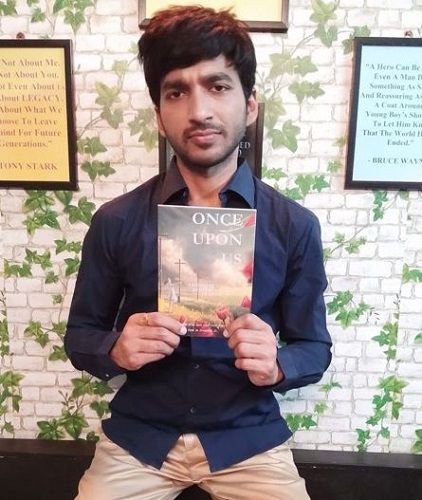 Abhiishek Mohta holding his novel