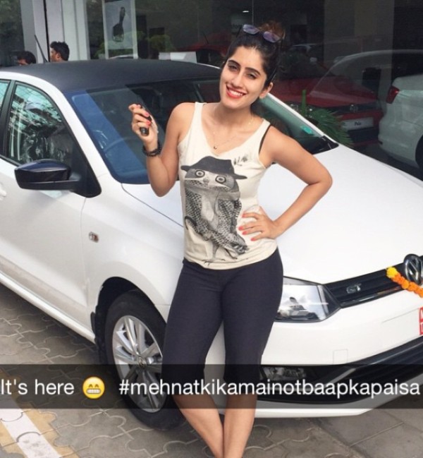 Akasa Singh standing beside her car Volkswagen Polo