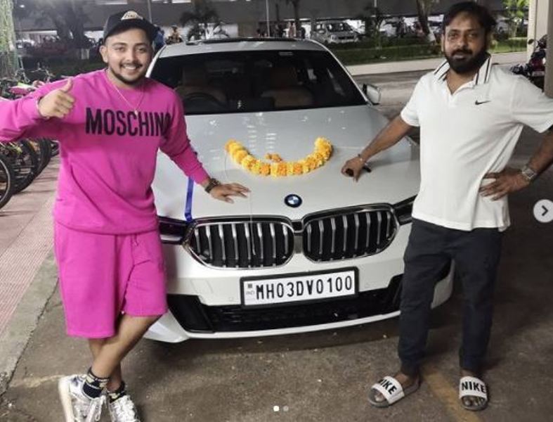 Prithvi Shaw posing in front of his BMW 6 Series Gran Turismo