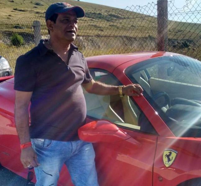 Sharad posing with his car