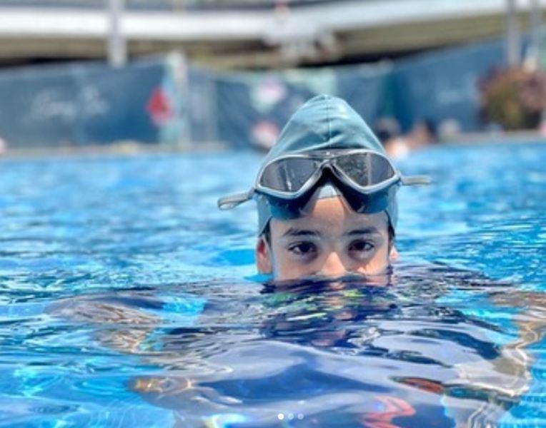 Shinda Grewal while learning swimming