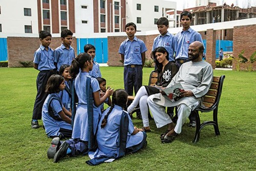 Shiv Nadar with his daughter and students at one of the Vidyagyan Schools in Uttar Pradesh