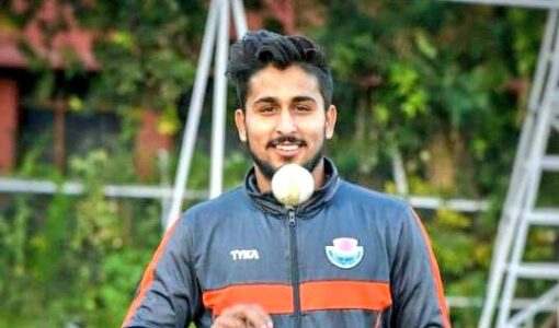 Umar Malik with a ball