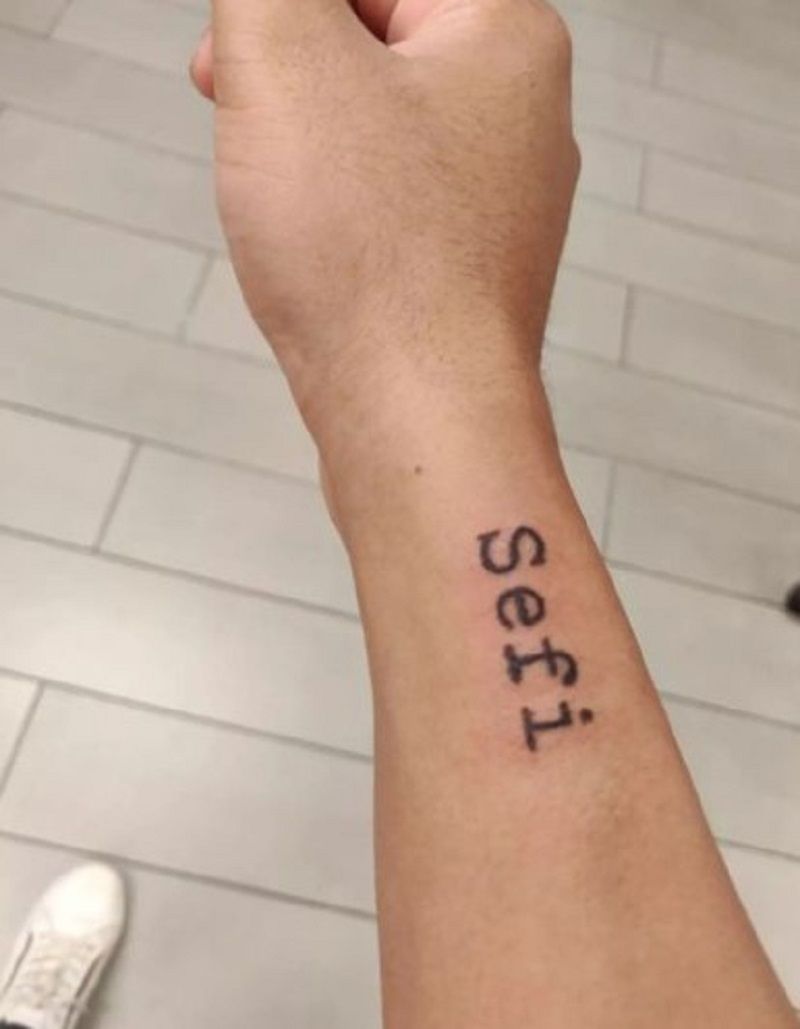 Adish`s tattoo with the name of his dog