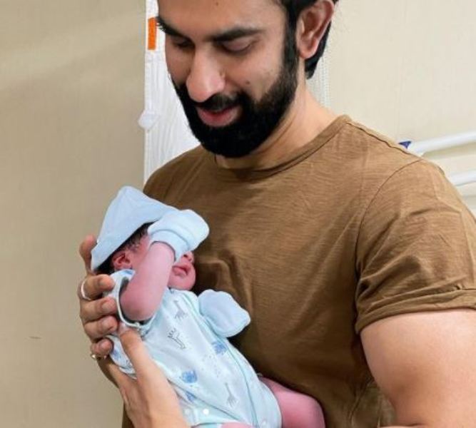 Rajeev Sen holding his baby girl