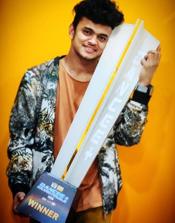 Sanket Gaonkar posing with the Dance Plus trophy