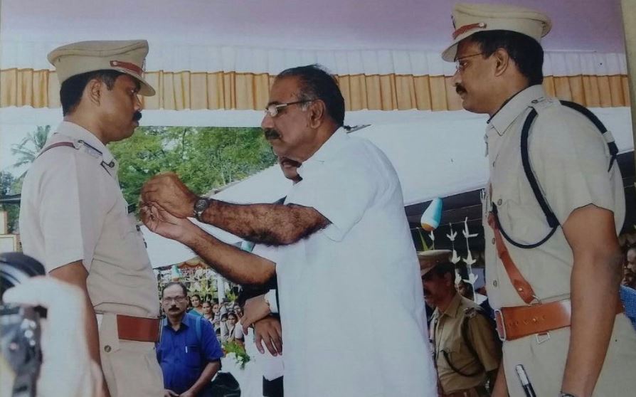 Sibi Thomas while receiving the Chief Minister's Police Medal in 2015