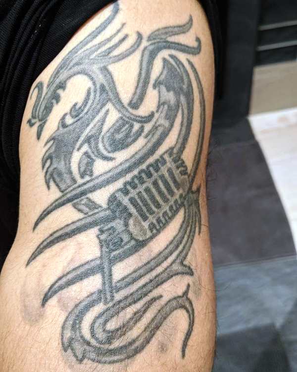Vir Das' Phoenix with a Mic tattoo