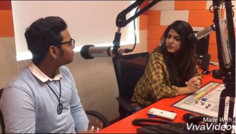Ayush Gupta while conversing with a radio jockey in a radio interview