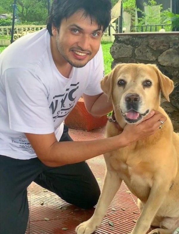 Chirag posing with his dog